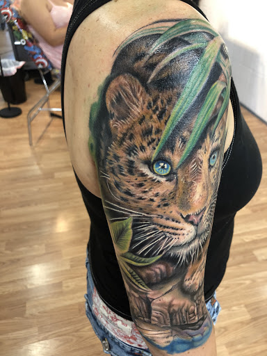 Explore race car tattoo ideas, creative tattoo ideas in Sarasota, available at SEVEN SINS Tattoo Studio