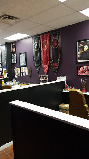 Explore black and grey sleeve tattoo ideas, creative tattoo ideas in Hazard, available at Electric Chair Tattoo