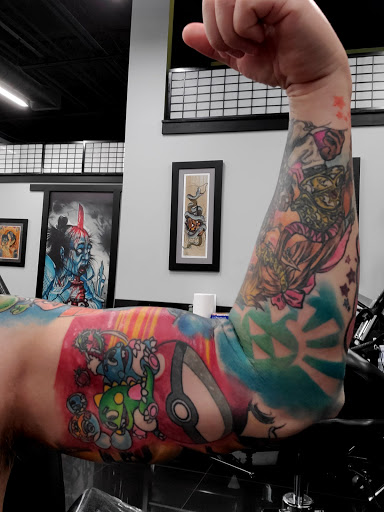 Explore inner ear tattoo ideas, creative tattoo ideas in Addison, available at Cat Tattoo