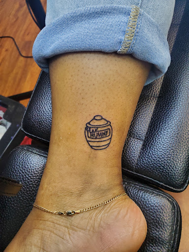 Explore vintage halloween tattoo ideas, creative tattoo ideas in Cocoa, available at Rorschach Tattoo Shop and Piercing Studio