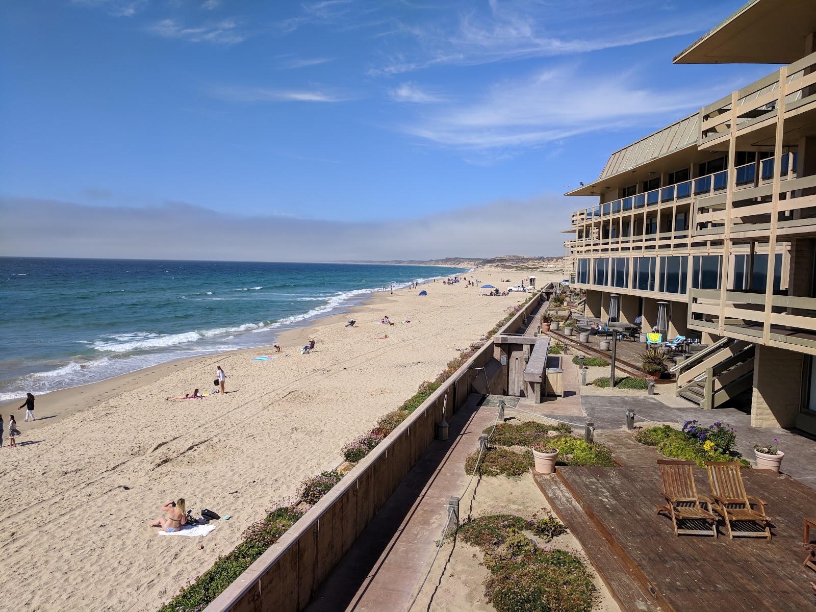 Photo of Monterey beach with long straight shore