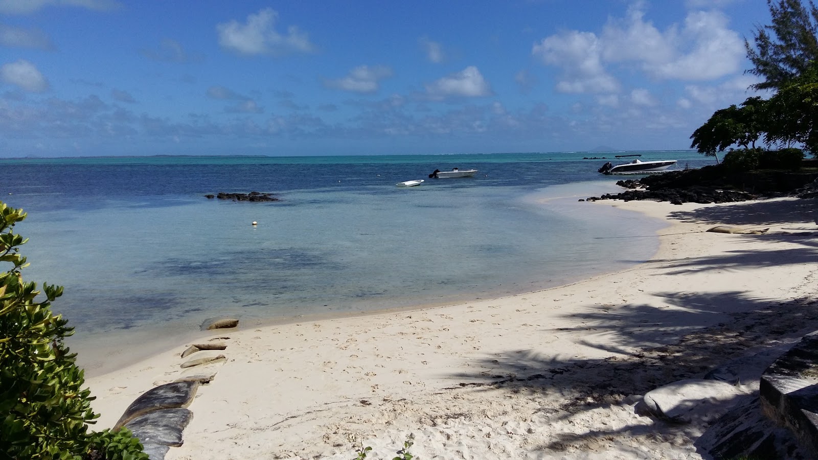 Photo of Roches Noires Beach with spacious shore