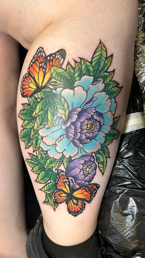 Explore flower tattoo ideas arm, creative tattoo ideas in Cedar Falls, available at Tales Untold Tattoos
