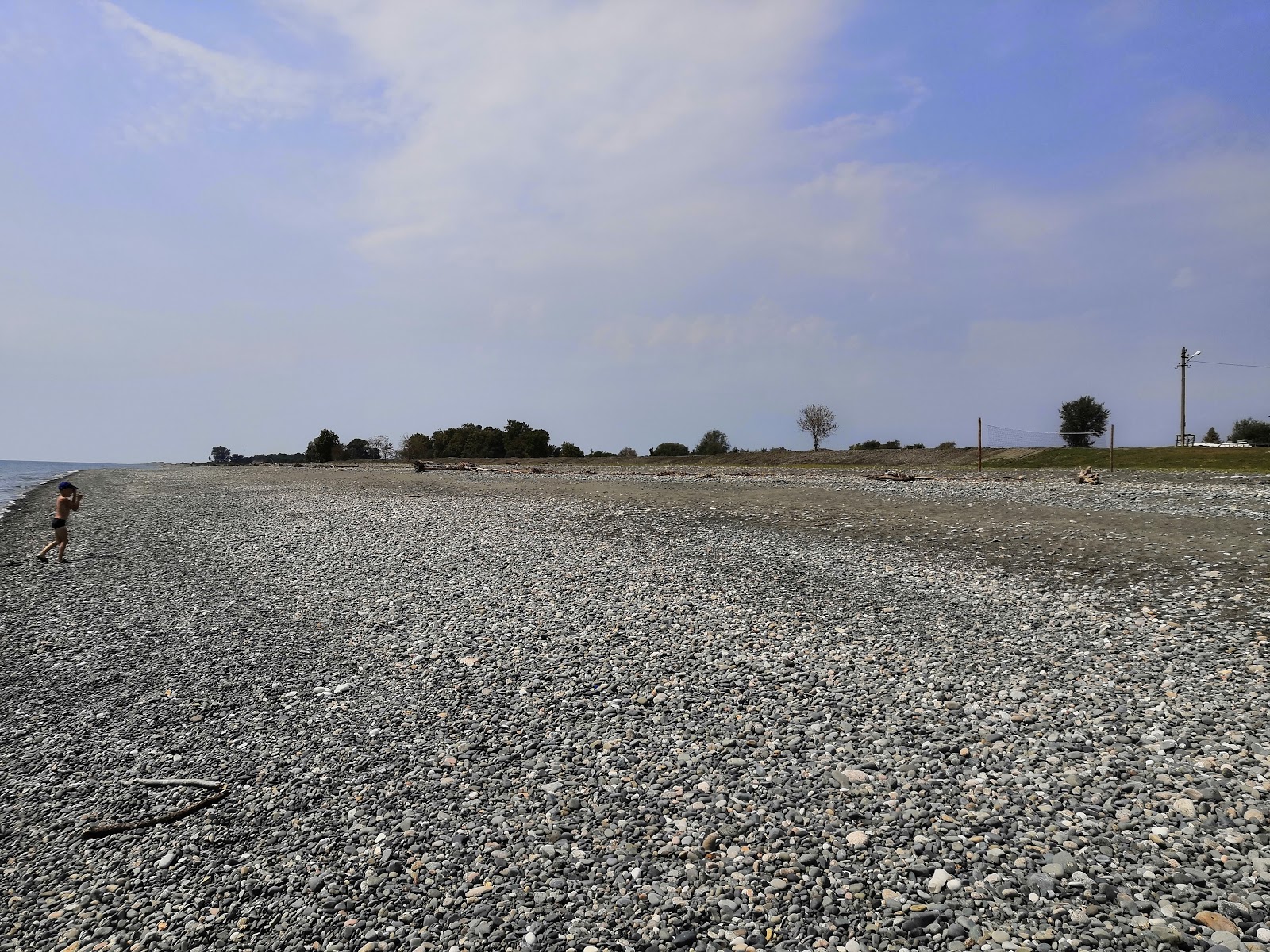 Foto van Skurcha beach met recht en lang