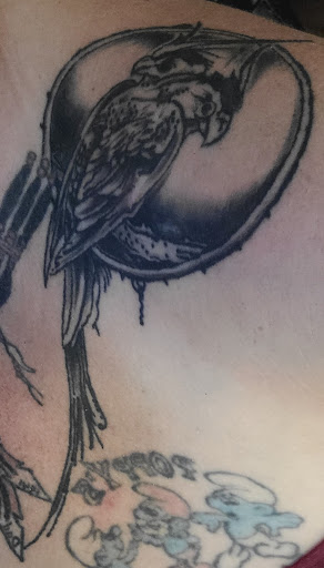 Find breast tattoo ideas for females for your next unique tattoo in Kerhonkson at RedHawk Tattoos