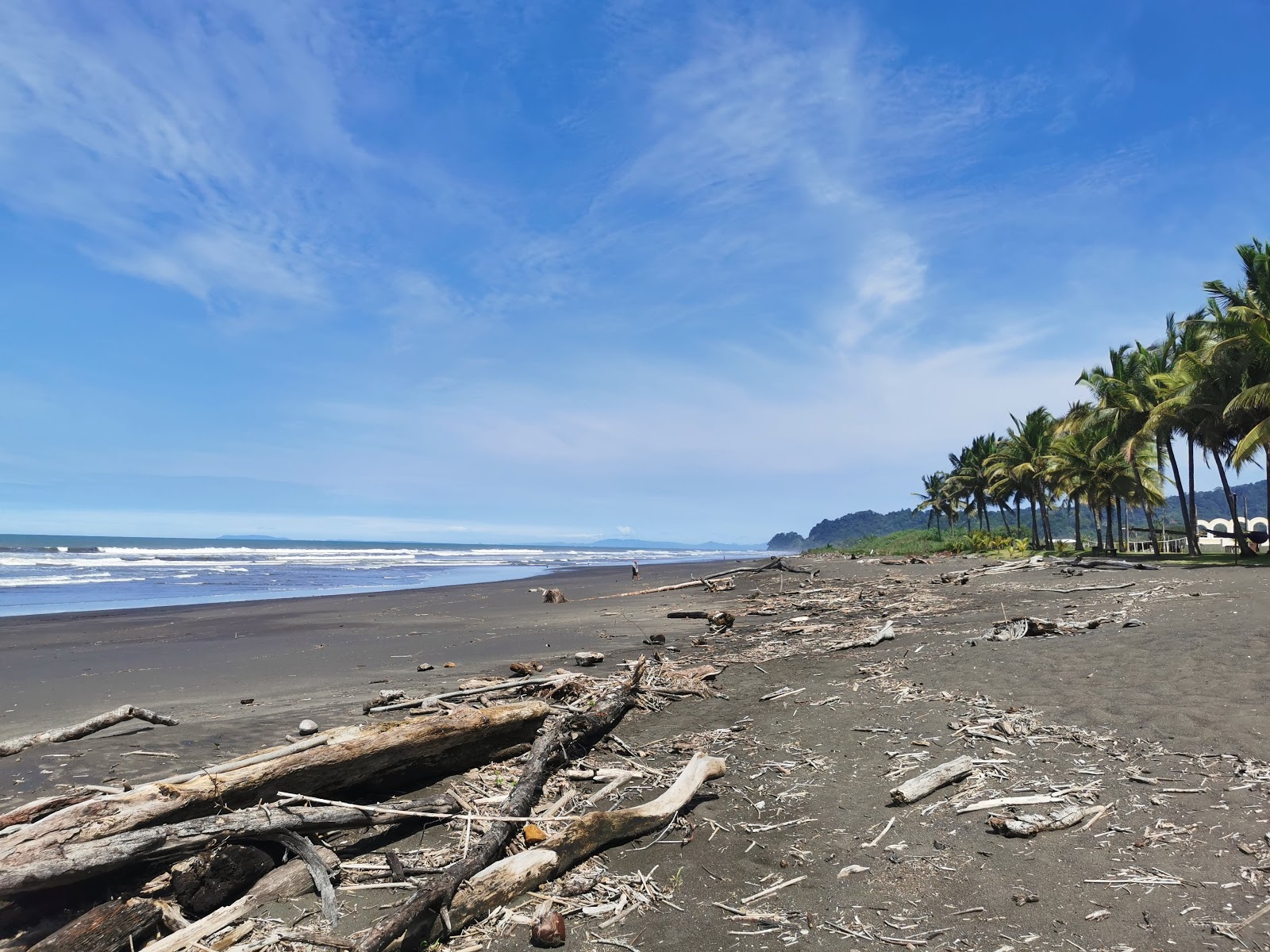 Zdjęcie Playa Hermosa z powierzchnią brązowy piasek