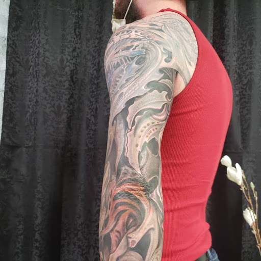 Explore roses tattoo ideas, creative tattoo ideas in Mebane, available at The Cardinal Skin Art & Gallery