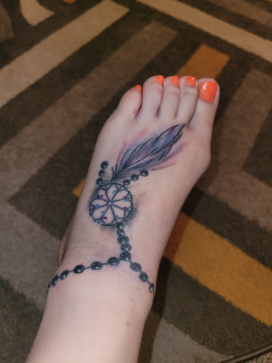 Explore motorbike tattoo ideas, creative tattoo ideas in Lincoln, available at Edison Tattoo and Body Piercing