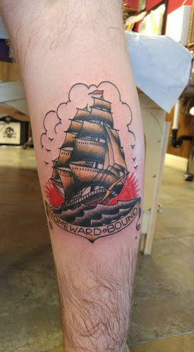 Explore brass knuckle tattoo ideas, creative tattoo ideas in Redding, available at The Salty Sloth Tattoo