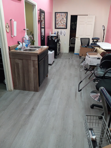 Explore loyalty over love tattoo ideas, creative tattoo ideas in Charleston, available at Nemesis Tattoo and Art Gallery