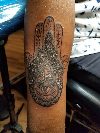 Find dragon arm tattoo ideas for your next unique tattoo in Syracuse at Carmelos Ink City