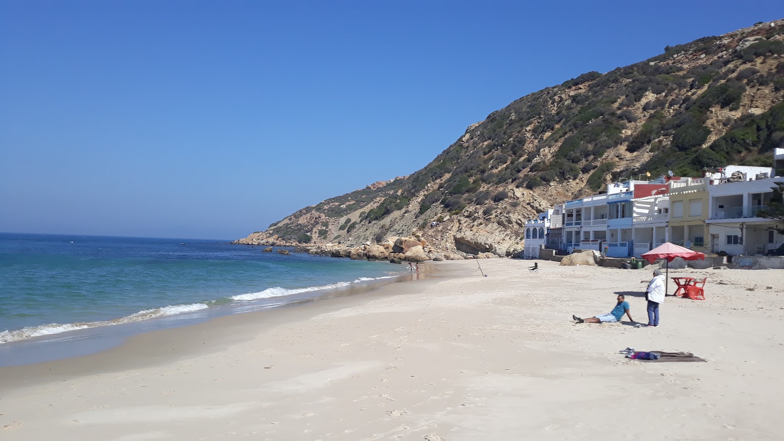 Foto van Playa Blanca ondersteund door kliffen