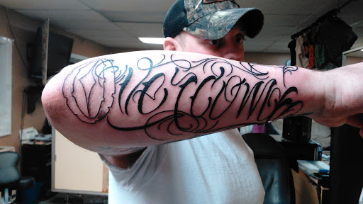 Explore belly button tattoos ideas, creative tattoo ideas in Newport, available at T N T Explosive Tattoo