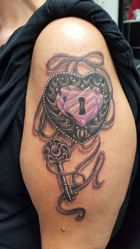 Explore apple tattoo ideas, creative tattoo ideas in Wichita, available at Body Canvas Tattooing