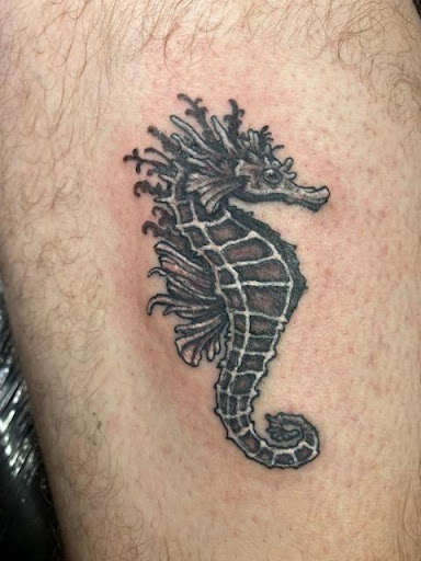 Explore bourbon glass tattoo idea, creative tattoo ideas in Sarasota, available at SEVEN SINS Tattoo Studio