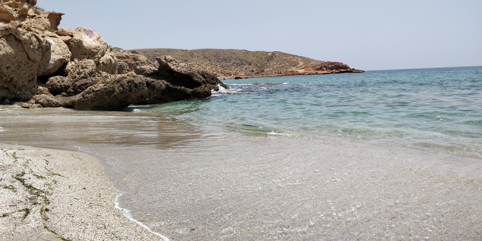 Foto di Cala Desnuda con micro baia