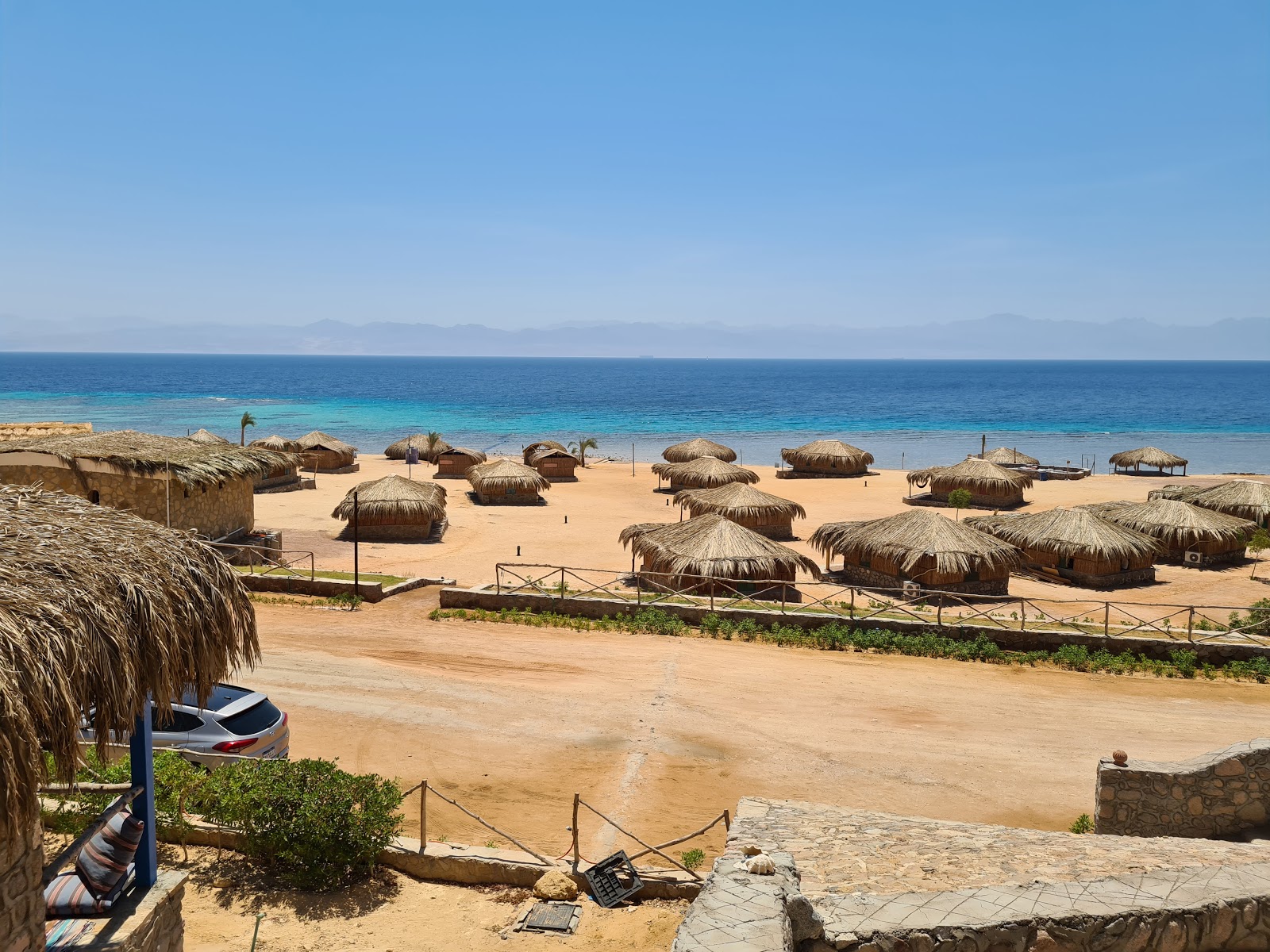 Photo of Ras Shaitan beach and the settlement