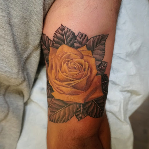 Find sunflower tattoo ideas for females for your next unique tattoo in Oxnard at Downtown Tattoo & Body Piercing