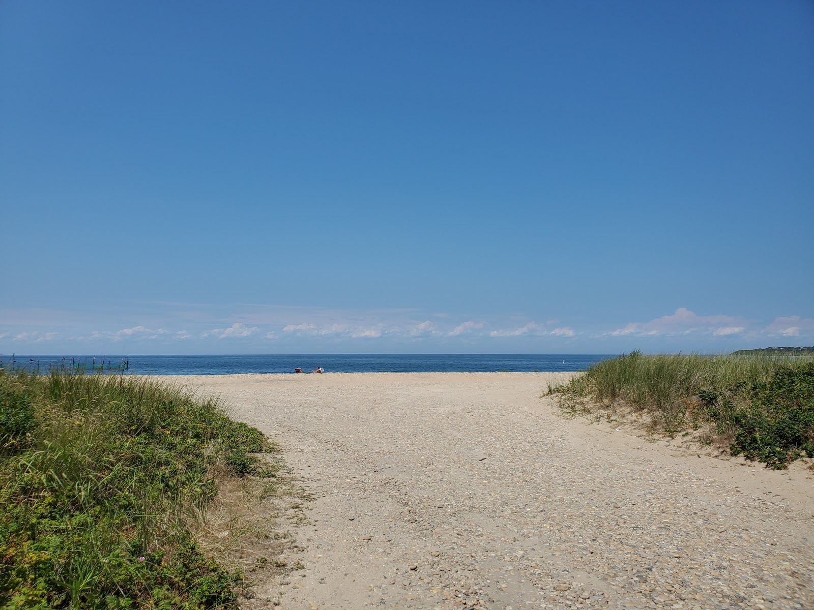 Foto von Navy Beach mit lange, gerade küste