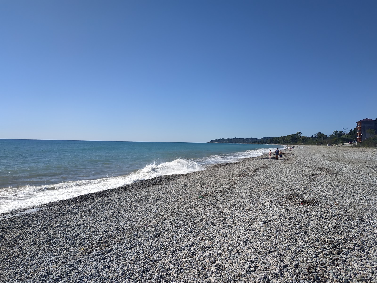 Photo of Leon beach with light fine pebble surface