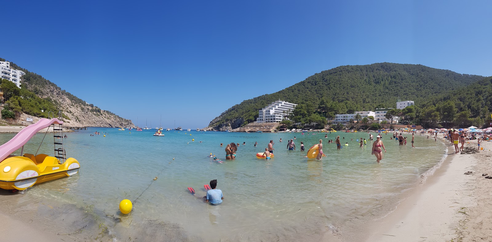 Photo of Cala Llonga beach surrounded by mountains