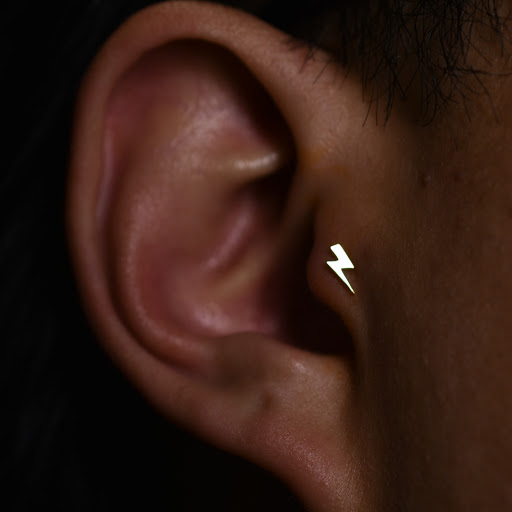 Explore bow tattoo ideas, creative tattoo ideas in Reno, available at Black Hole Body Piercing