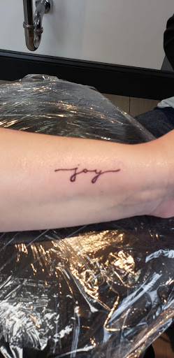 Explore cover up tattoo ideas on forearm, creative tattoo ideas in Flint, available at Electric Chair Tattoo