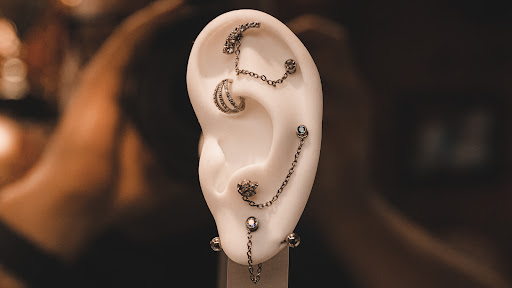 Explore ripped tattoo ideas, creative tattoo ideas in Des Moines, available at Axiom Body Piercing Studio