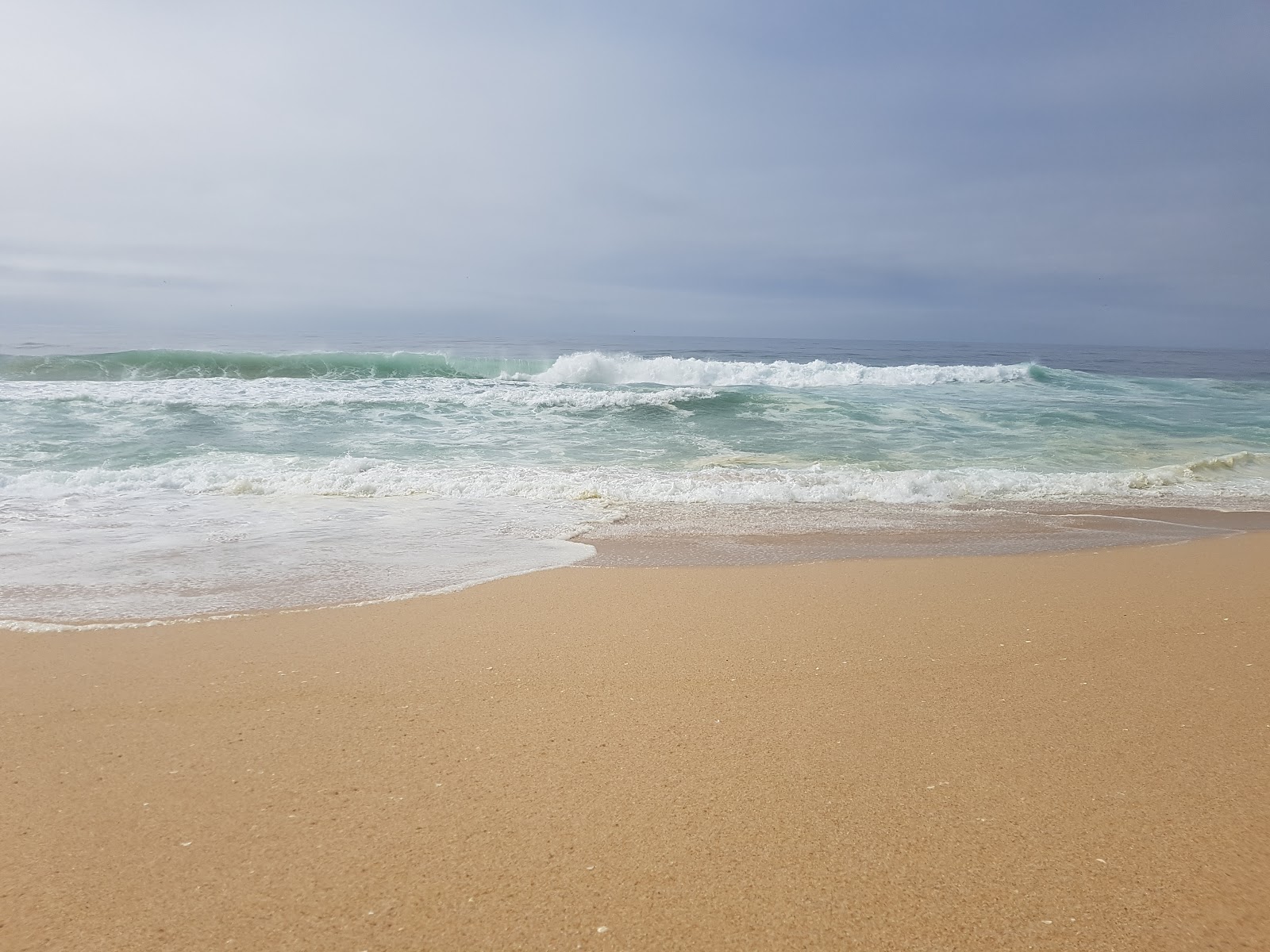 Santo Andre Beach的照片 带有碧绿色纯水表面