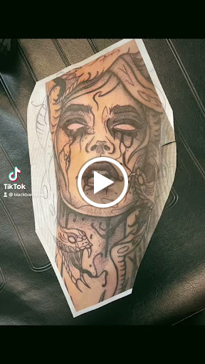 Find breast tattoo ideas for females for your next unique tattoo in Milledgeville at Black Barby Ink