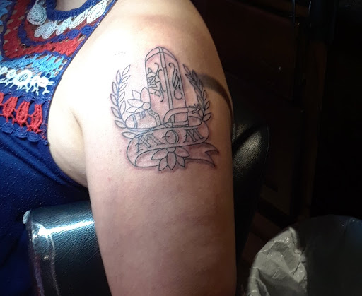 Explore lower back tattoo ideas for females, creative tattoo ideas in Fountain Valley, available at Lowrider Tattoo Studios