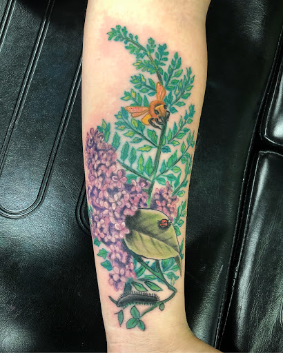 Explore globe tattoo ideas, creative tattoo ideas in Springfield, available at Poke and a Rub art studio