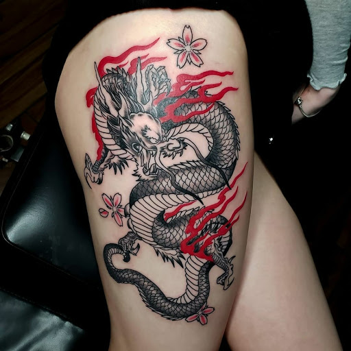 Find beach wave tattoo ideas for your next unique tattoo in Calhoun at A Sailors Grave Tattoo Parlor