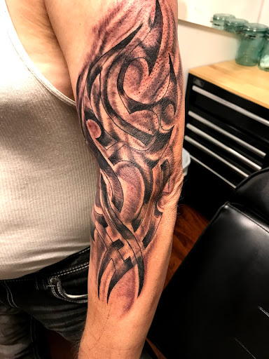 Explore woman arm tattoo ideas, creative tattoo ideas in Seymour, available at American Gypsy Tattoo Corp.