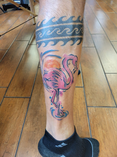 Find between breast tattoo ideas for your next unique tattoo in Stuart at Tiger Shark Tattoo Studio