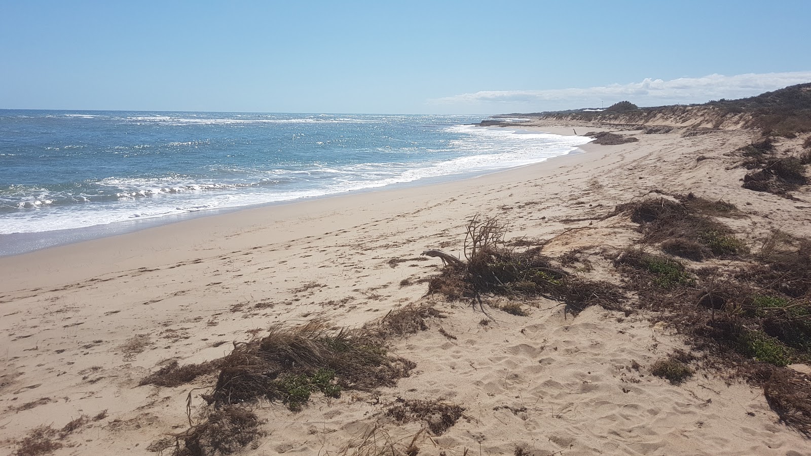 Foto von Seaspray Beach mit feiner beiger sand Oberfläche