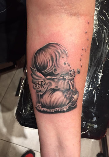 Explore butterfly spine tattoo ideas, creative tattoo ideas in Great Falls, available at Alpha Tattoos & Piercings