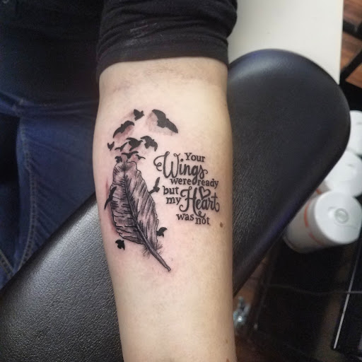 Explore blessed neck tattoo ideas, creative tattoo ideas in Hudson Falls, available at ALTERED ADDICTION TATTOOS