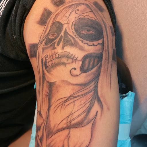 Explore squid tattoo ideas, creative tattoo ideas in Louisville, available at Creative Ink Tattoo Studio