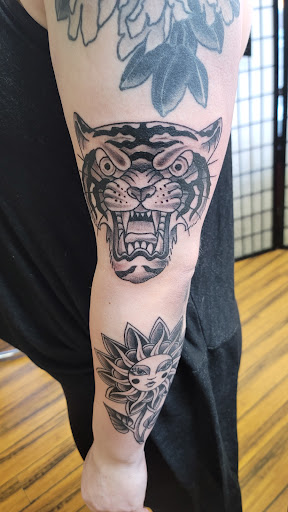 Explore halloween couple tattoo ideas, creative tattoo ideas in Green Bay, available at Skinny Buddha Tattoo