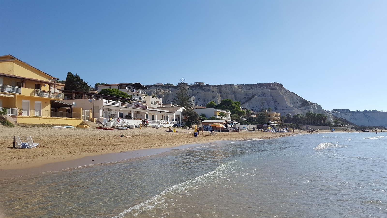Foto av Spiaggia di Capo Rossello med beige sand yta