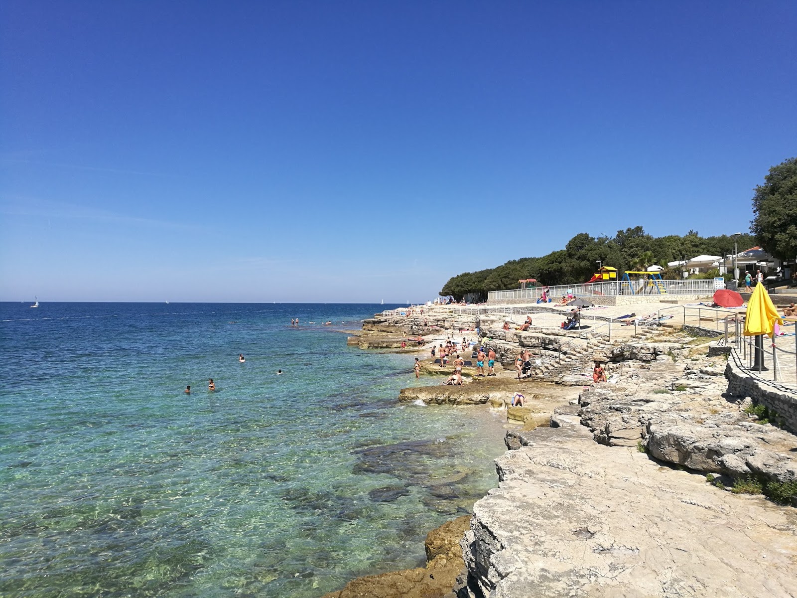 Fotografija Lanterna II beach z rjavi kamenček površino