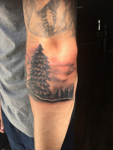 Explore heart and rose tattoo ideas, creative tattoo ideas in Chapel Hill, available at Golden Falcon Tattoo and Piercing