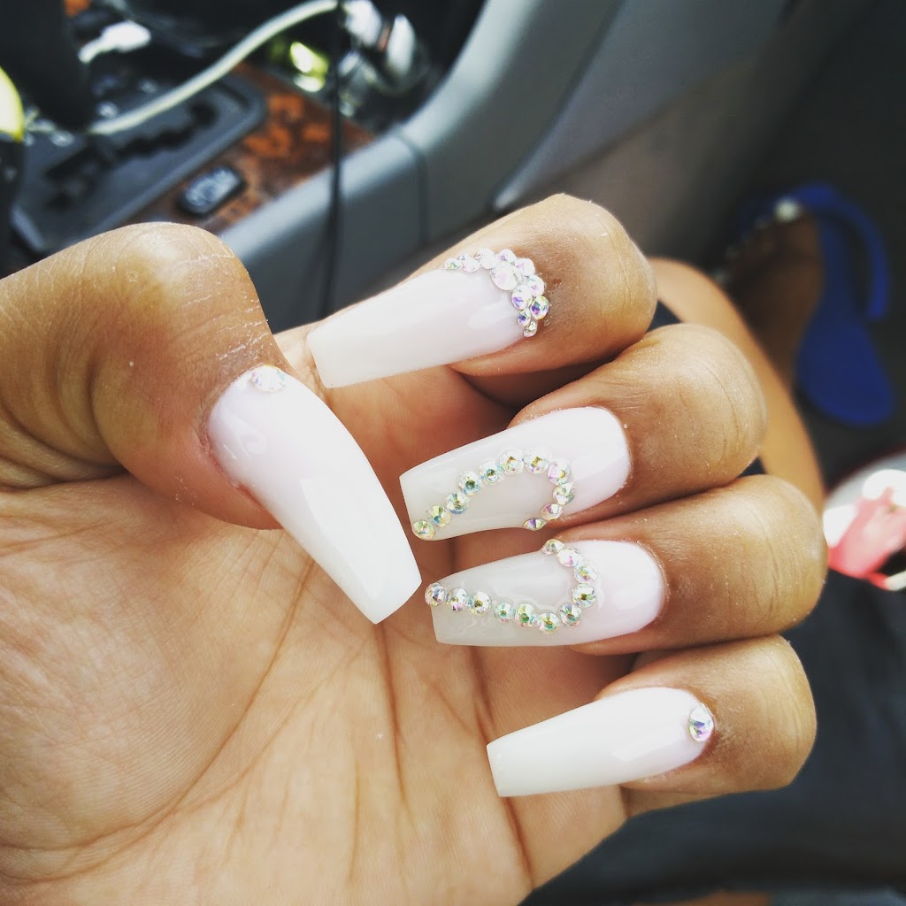 T C Nails 77033