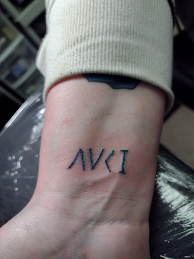 Explore wolf tattoo ideas for men, creative tattoo ideas in Owosso, available at Twisted ink tattoo