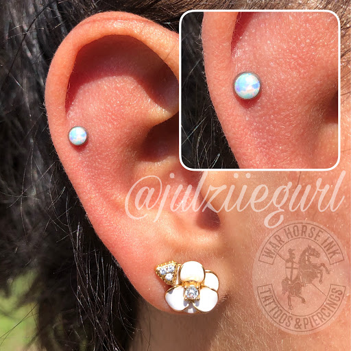 Explore solid black tattoo ideas, creative tattoo ideas in Kent, available at War Horse Ink