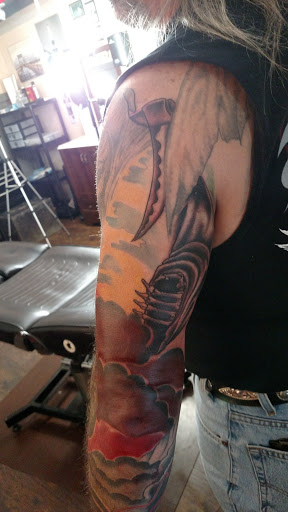 Explore broken heart tattoo ideas for guys, creative tattoo ideas in Kingsford, available at Deft Tattoo Studio