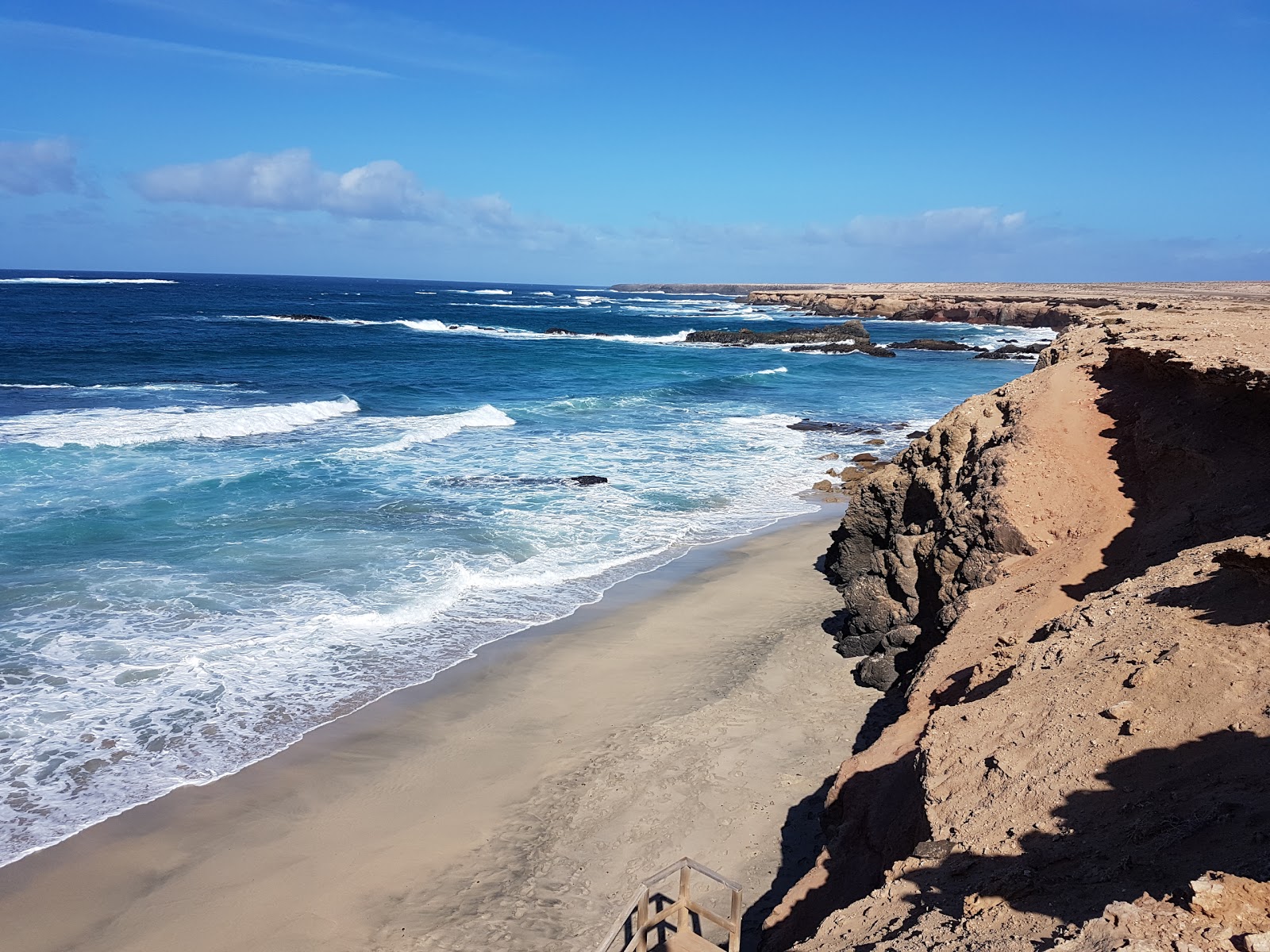 Foto av Playa de los Ojos med liten vik