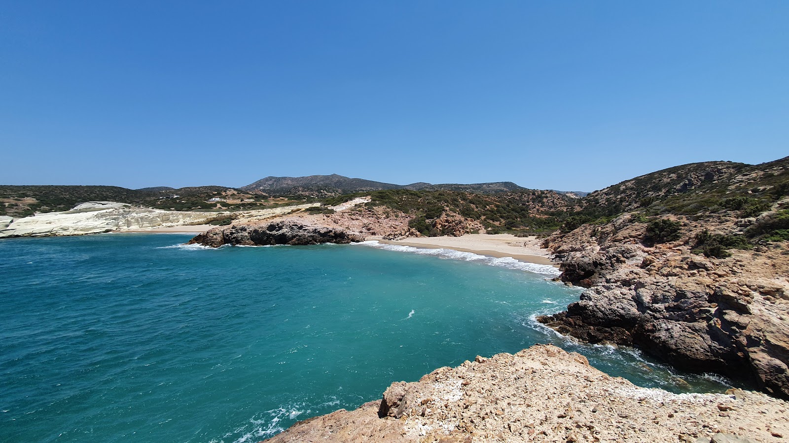 Photo of Triades beach with blue pure water surface