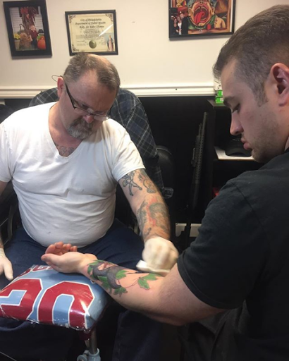 Explore ribbon tattoo ideas, creative tattoo ideas in Philadelphia, available at Daves Artistic Tattoo